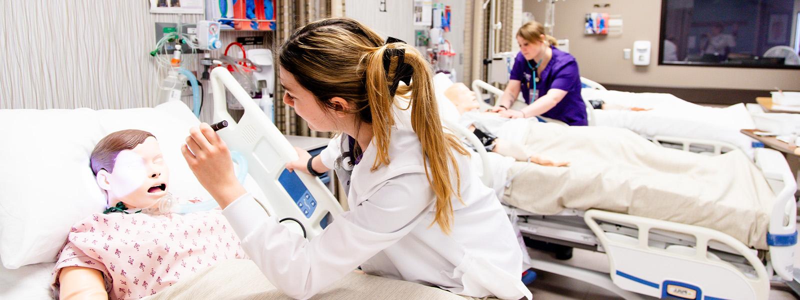 master of nursing graduates leave commencement carrying diplomas