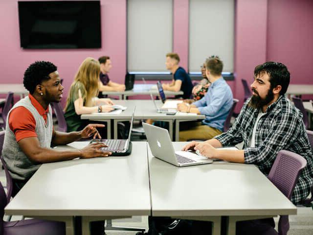 Students working on computers in classroom